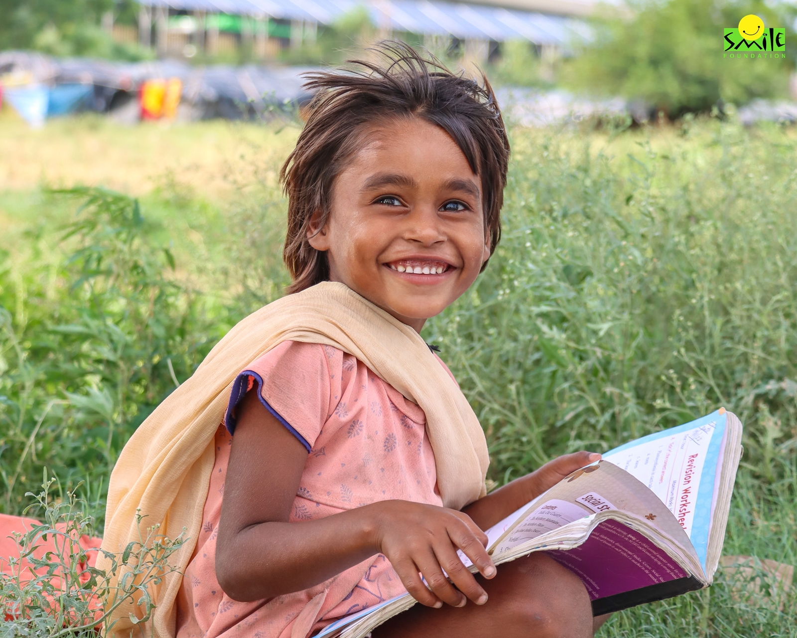 A girl child reading a book