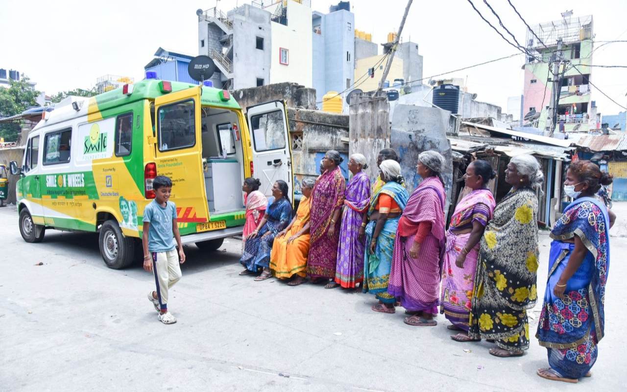 People queuing up outside Smile on Wheels van