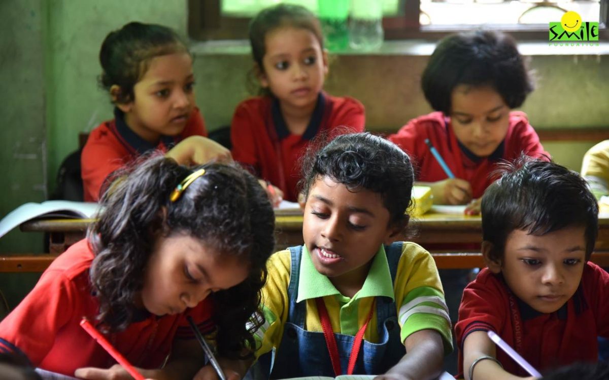 Children studying in a classroom of Smile Foundation