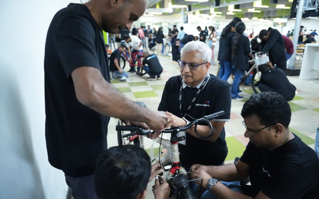 Western Digital employees build bicycles for children